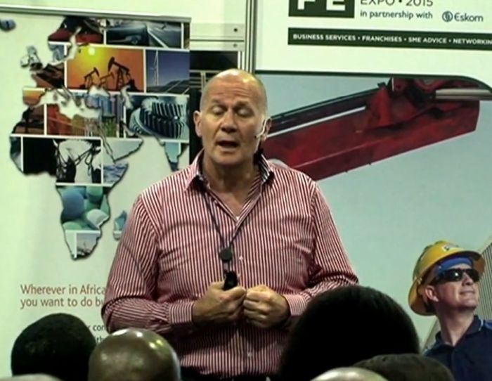Neale Roberts presenting at a corporate business event