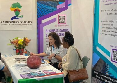The SA Business Coaches stand, showing the Turn Uncertainty into Clarity banner