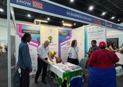 The SA Business Coaches stand beneath the Business Show :: Africa 2026 signage