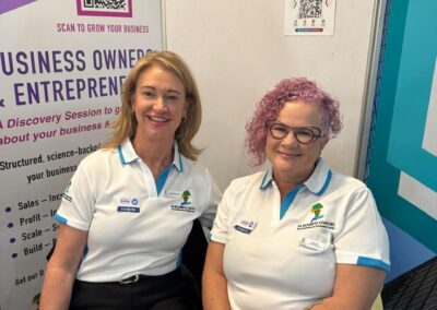 Two SA Business Coaches team members beside the Business Owners and Entrepreneurs banner